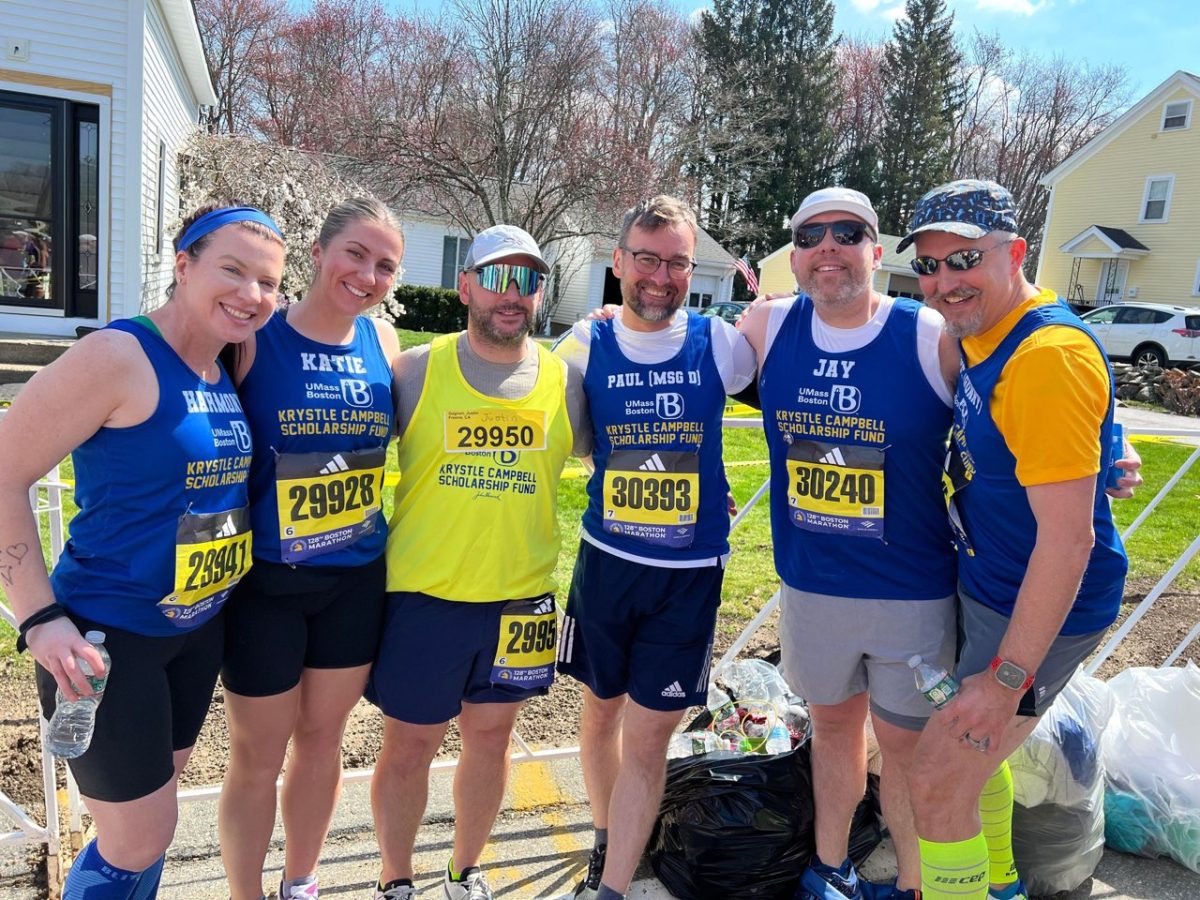 Several members of Team Krystle Campbell pose for a photo before the 2024 Boston Marathon. Photo submitted by Professor Paul Dyson.