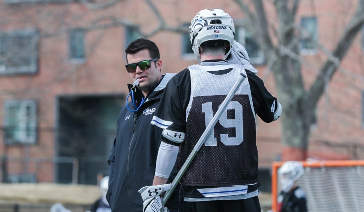 Men%E2%80%99s+lacrosse+head+coach+Tyler+Low+communicates+with+a+player+during+practice.+Photo+sourced+from+Beacon+Athletics.