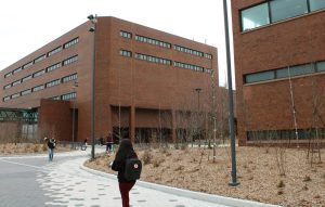 Students walk in the courtyard outside of Phillis Wheatley Hall and McCormack Hall in between their classes.