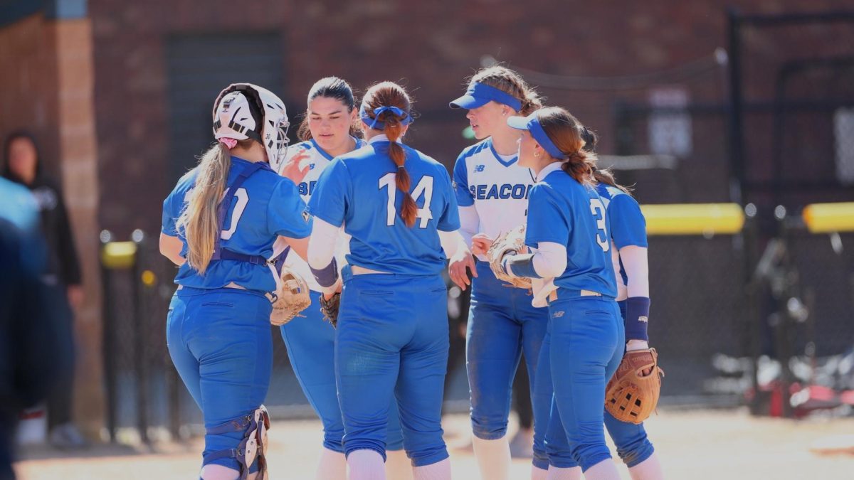 UMass Boston Softball players gear up at a recent game. Photo provided by Beacons Athletics. 