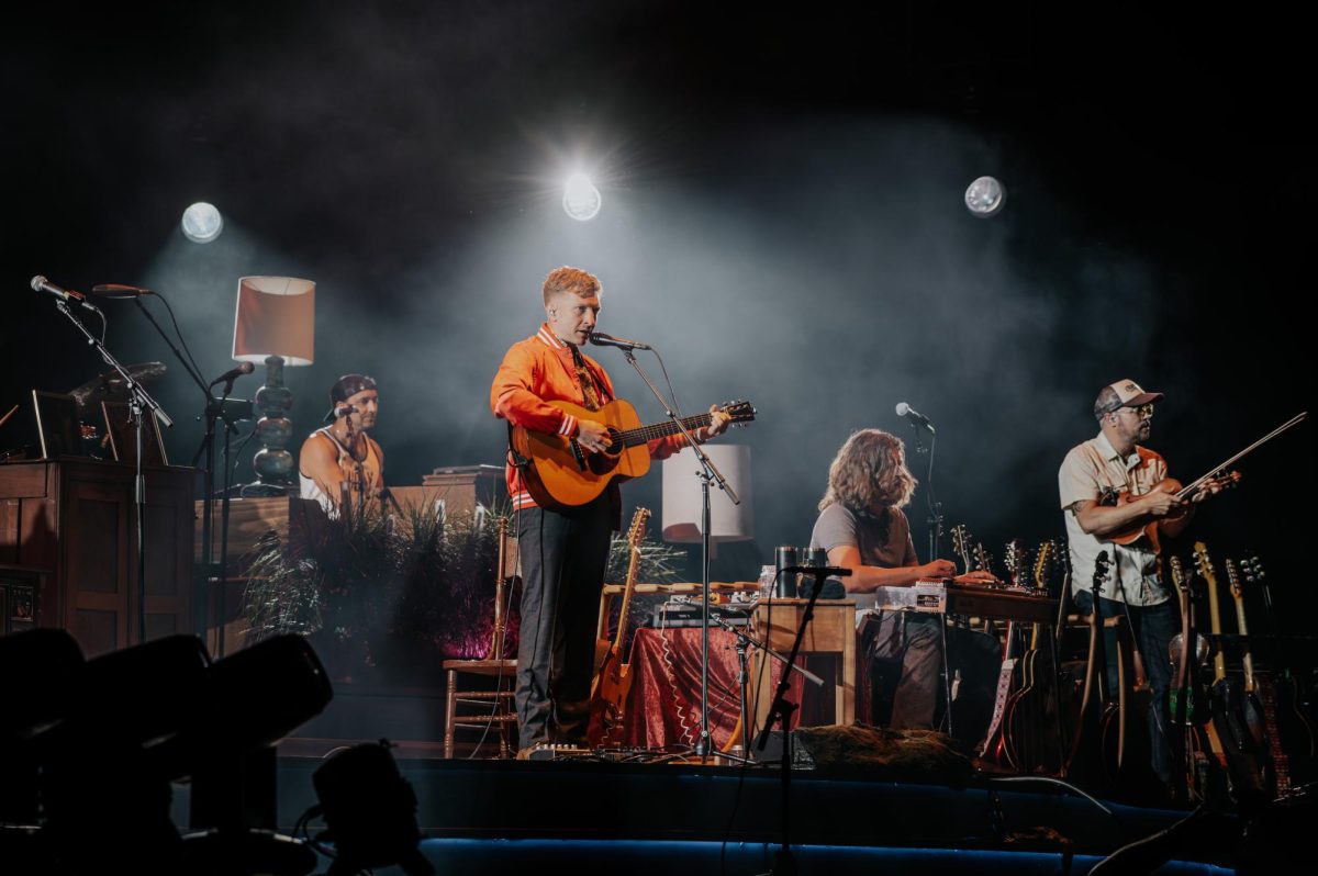 Tyler Childers playing guitar on stage to end Day Two of Boston Calling. Photo by Olivia Reid/ Photography Editor.