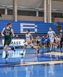 Emmanuel Zayas and Mariano Olivier Rodriguez run up court at a men’s basketball game last season.