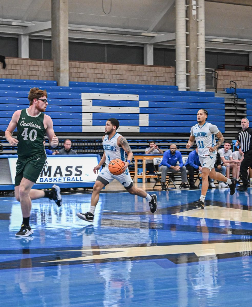 Emmanuel Zayas and Mariano Olivier Rodriguez run up court at a men’s basketball game last season. Photo by Olivia Reid/ Photography Editor.