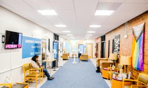 A student sits in the University Health Service Center, which is also home to the Counseling Center.