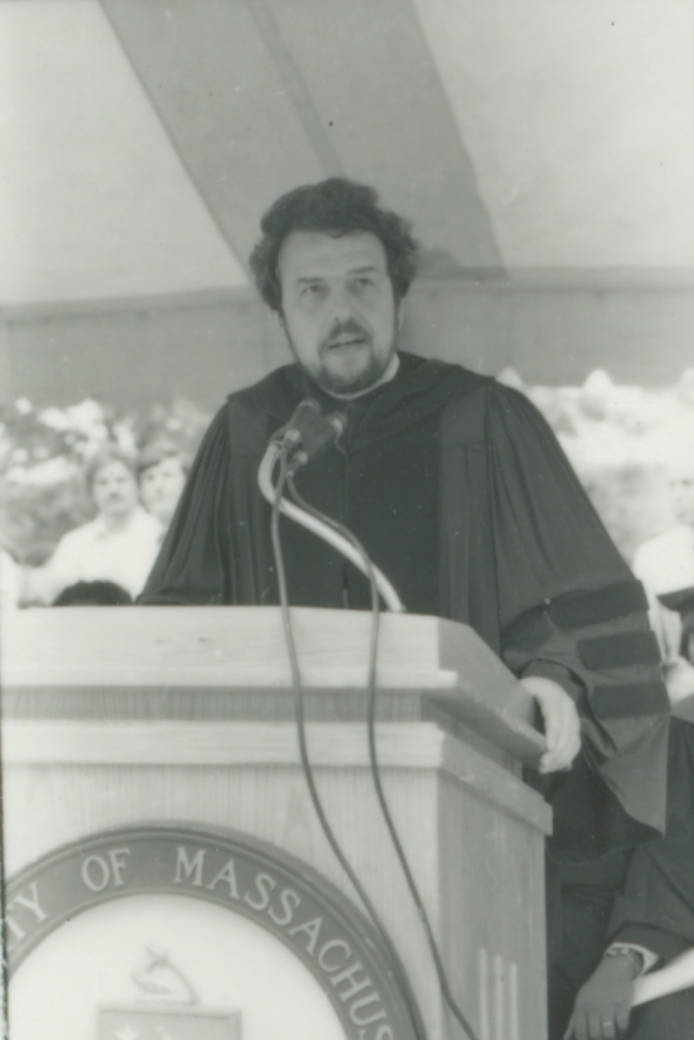 Chancellor Robert A. Corrigan giving the address at the 1980 Commencement held at the Columbia
Point campus plaza between the Quinn Administration Building and the Joseph P. Healey Library. Corrigan served as Chancellor from 1979-1988. Photo from the University of Massachusetts Boston
digital collections.