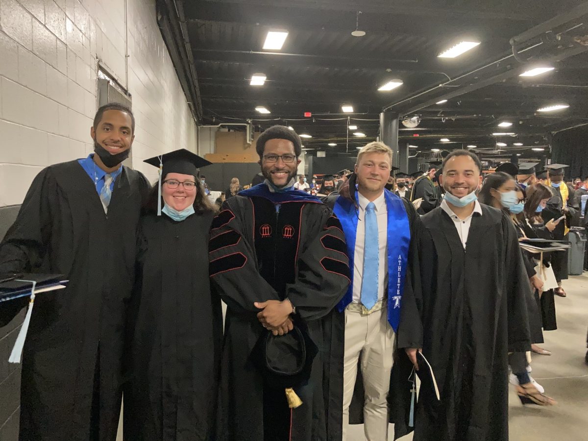 Students graduate from the Sport Leadership and Administration program in 2021. From left to right: Sam Sena Nov, Jennifer Radigan, Jack Dobrzynski and Alex Redding. Photo courtesy of Dr. Cooper, center. 