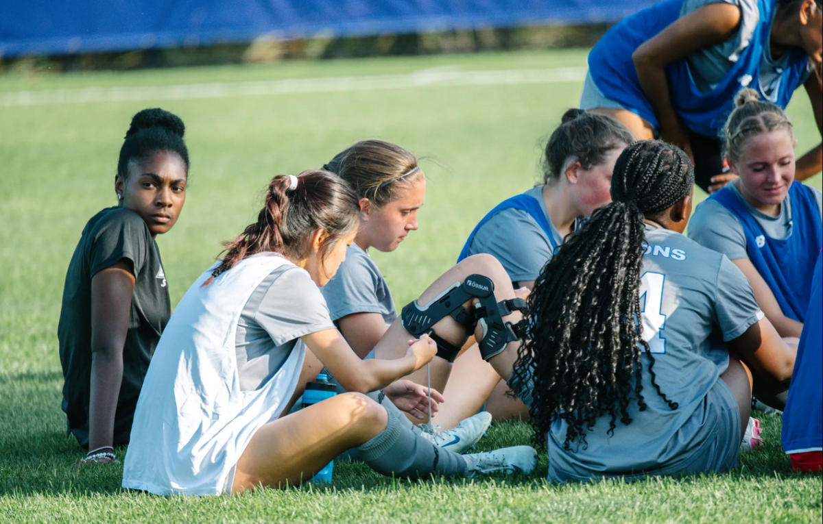 Women's soccer during a huddle against the Wolves.