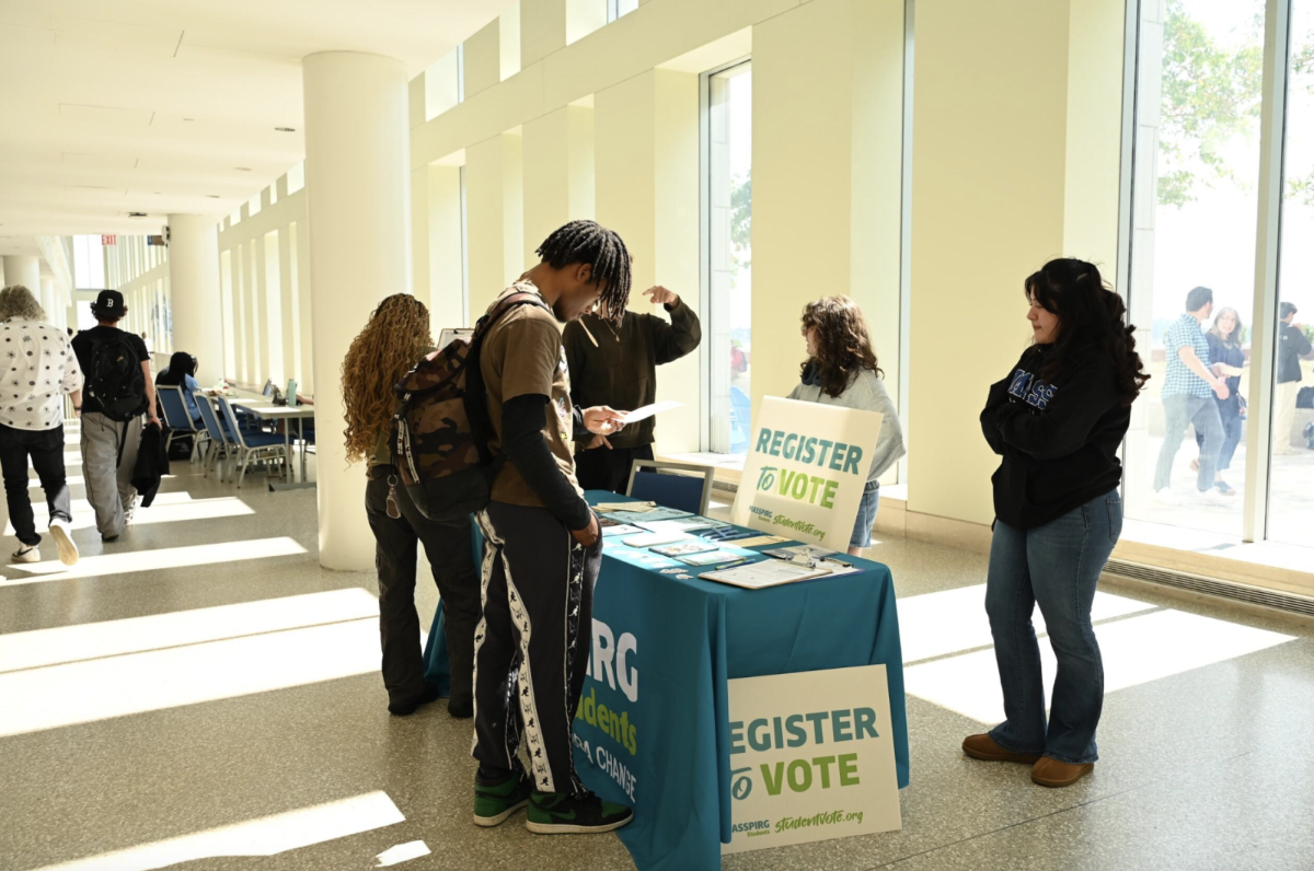 Students register to vote ahead of the election November 5.