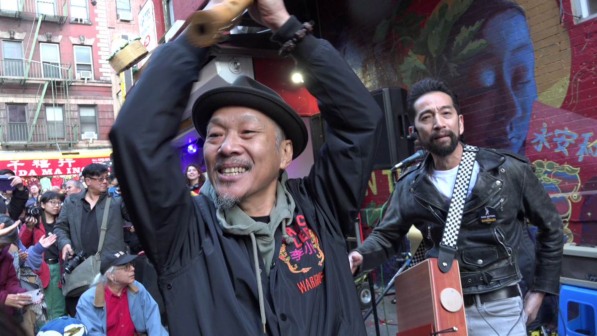 People celebrate at the unveiling of Corky Lee Street in Chinatown, NYC. Photo by Alex Lozupone, licensed under CC BY 4.0.