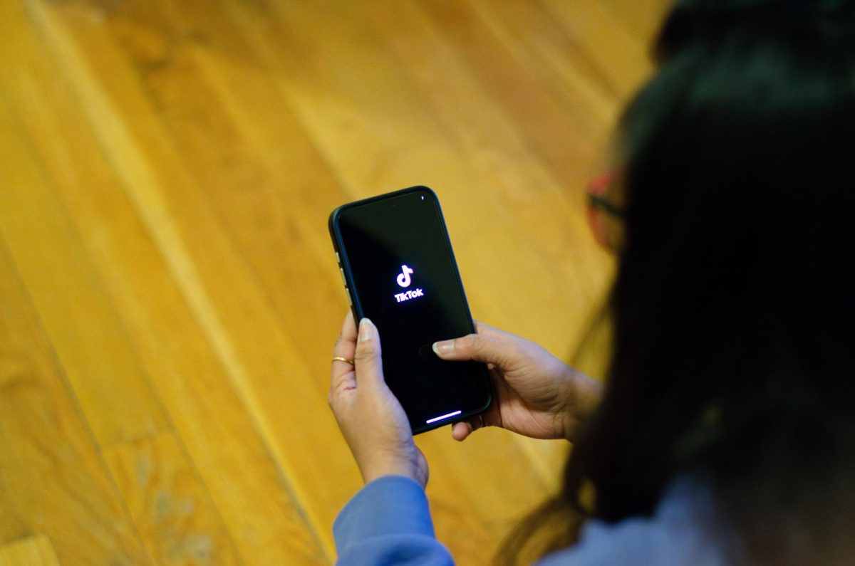 A student scrolls through TikTok, one of the major ways politicians are reaching voters in the 2024 election.