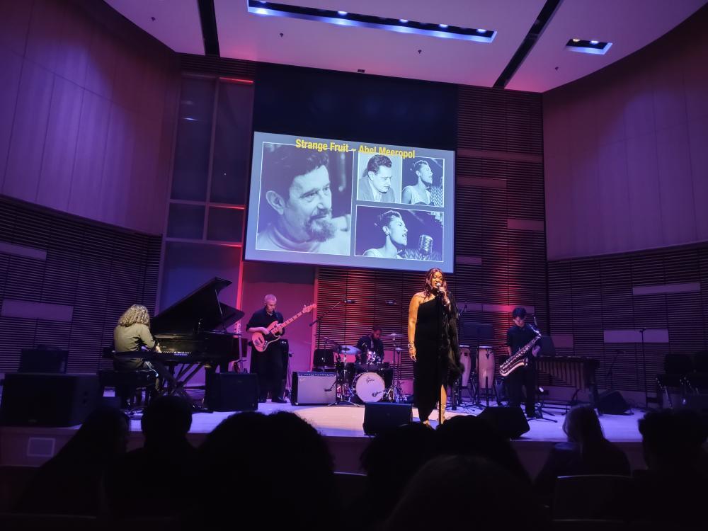 A projector displayed images of Jazz greats while students played covers of contemporary jazz songs.