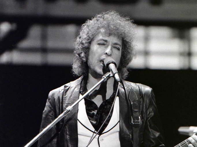 Bob Dylan performing in 1978. Photo by Chris Hakkens is licensed under CC BY-SA 2.0.