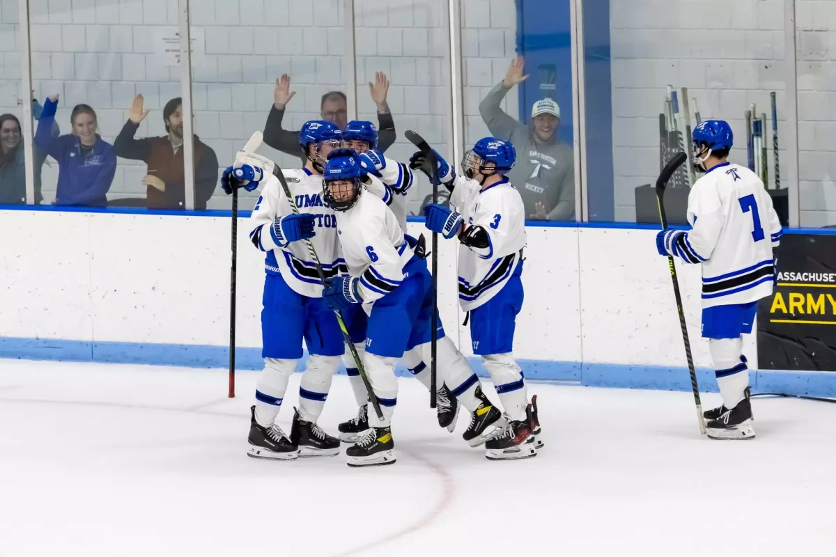 Beacons celebrate win against Elmira on Jan. 17. Photo by Becky Schoenecker/ Beacon Athletics. 