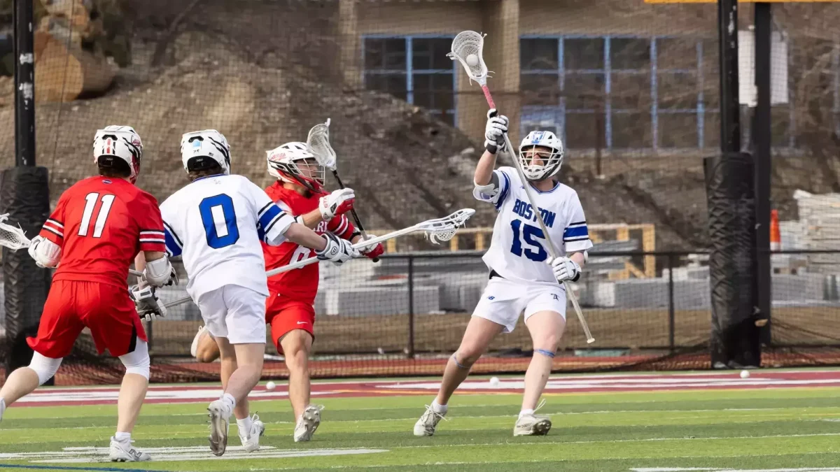 Graduate student Patrick Carey catches a pass in a game again Clark University this season. Photo from Beacons Athletics.