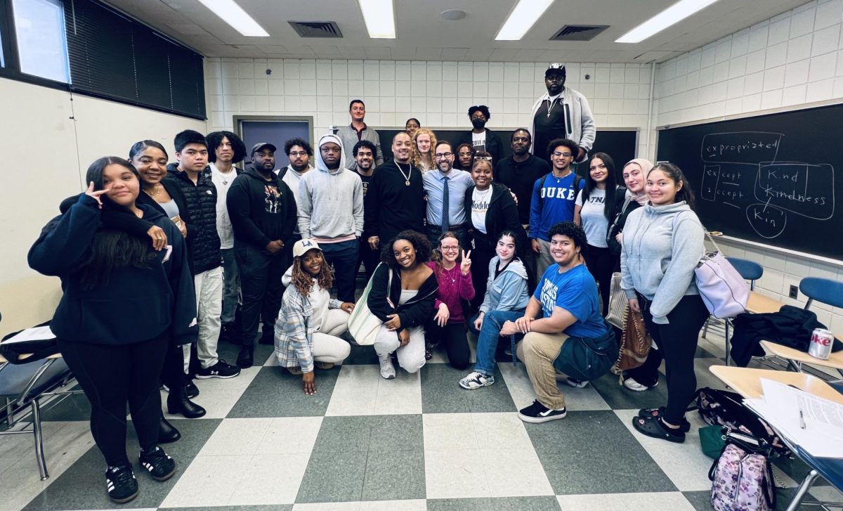 Keith Jones stands surrounded by students in a classroom. Courtesy of Keith Jones
