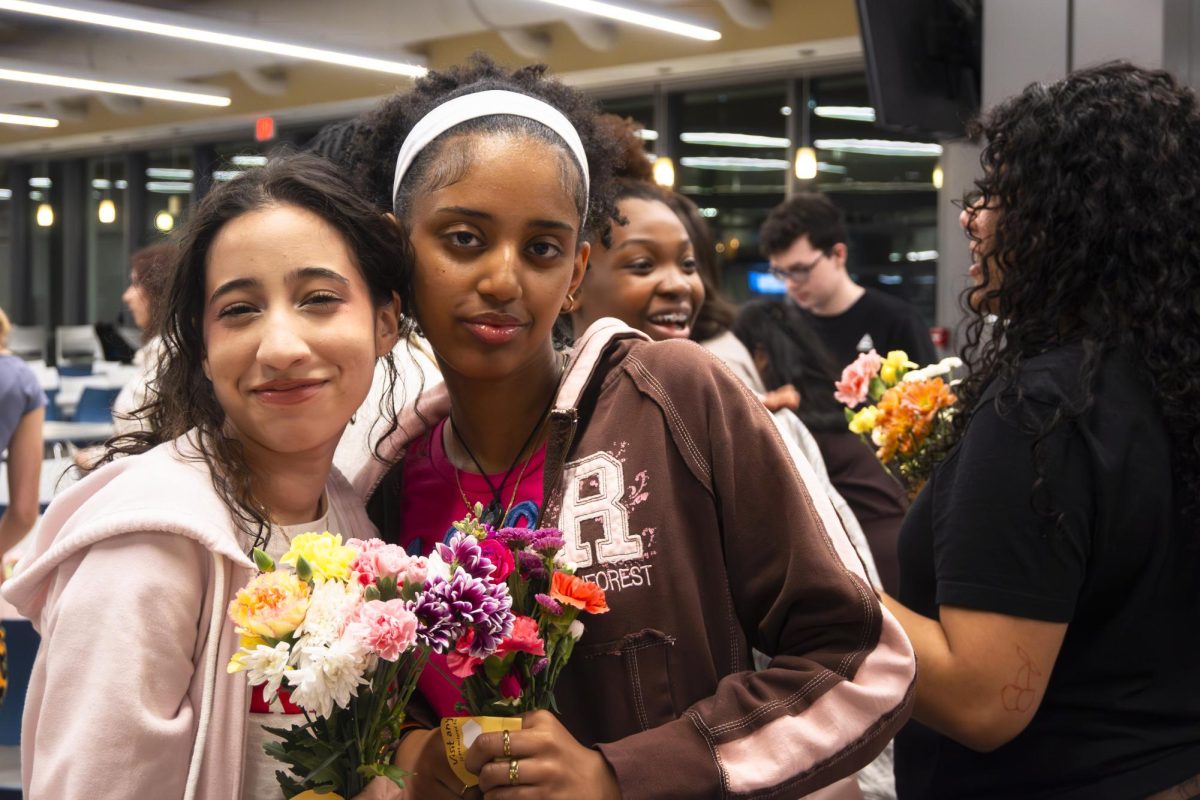 Currently and formerly displaced East Hall residents return for bracelet and bouquet making.
