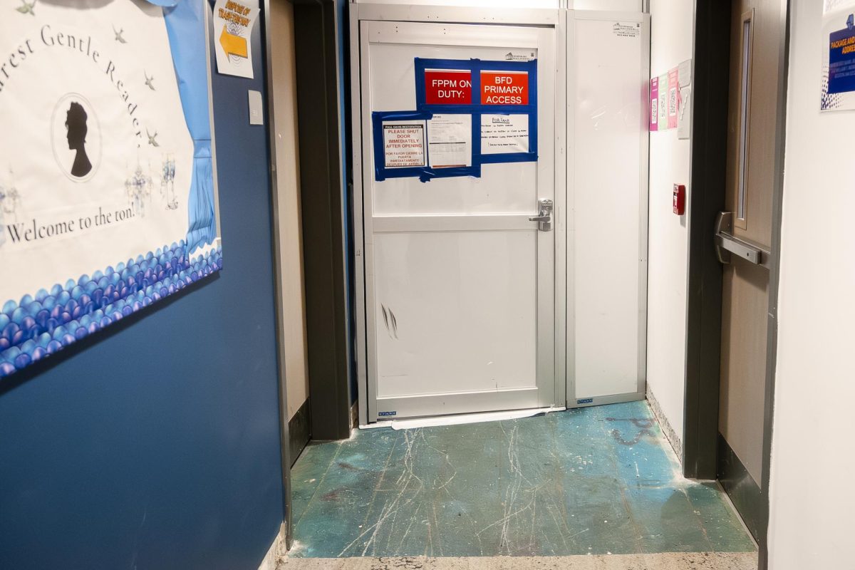 Temporary doors separate repair construction from the newly re-opened residential space in East Residence Hall.