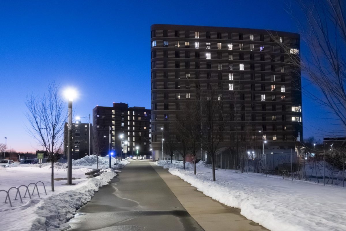 A view of East Residence Hall on March 1, windows lit again as some students are able to move back in.