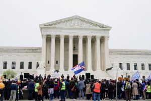 Immigrants' rights activists and demonstrators attend a rally outside the U.S. Supreme Court, as justices were scheduled to hear arguments on whether the administration of U.S. President Donald Trump can end the Temporary Protected Status (TPS) of Syrian and Haitian nationals, in Washington, D.C., U.S., April 29, 2026. REUTERS/Nathan Howard